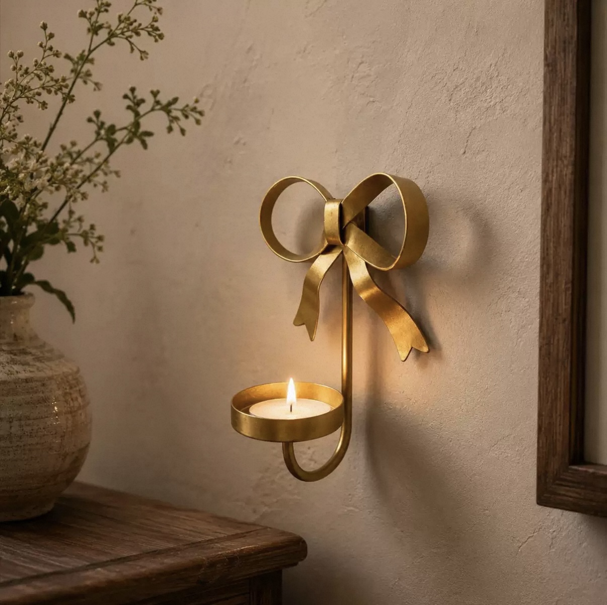 Brass bow wall-mounted tealight candle holder
