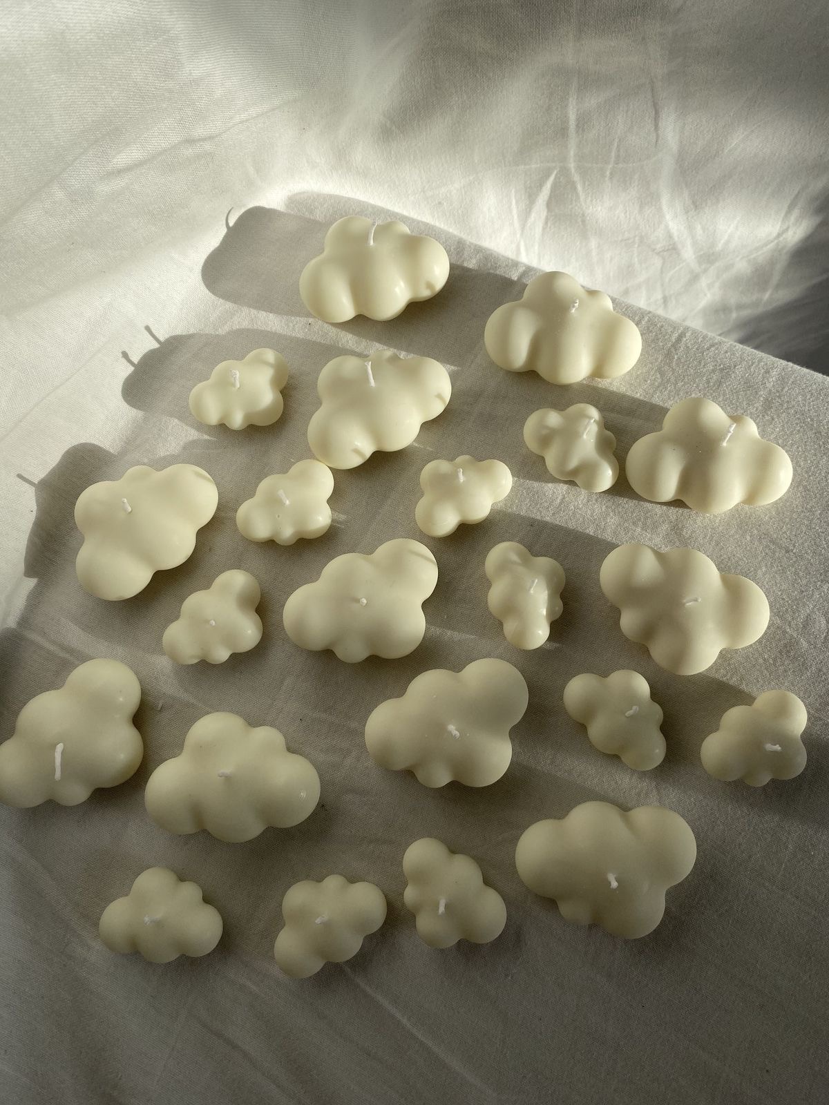 Cloud Candle — Soft cloud forms in two sizes.