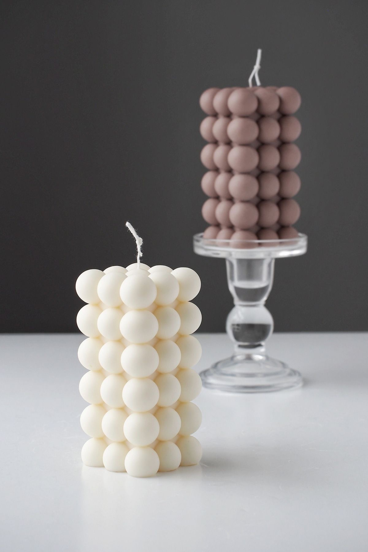 Bubble Column Candle — A tall column built from smooth rounded bubbles.