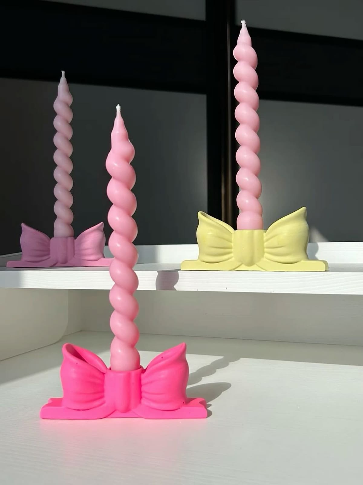 Colourful Bow Taper Candle — Playful twisted tapers with colourful bow bases.