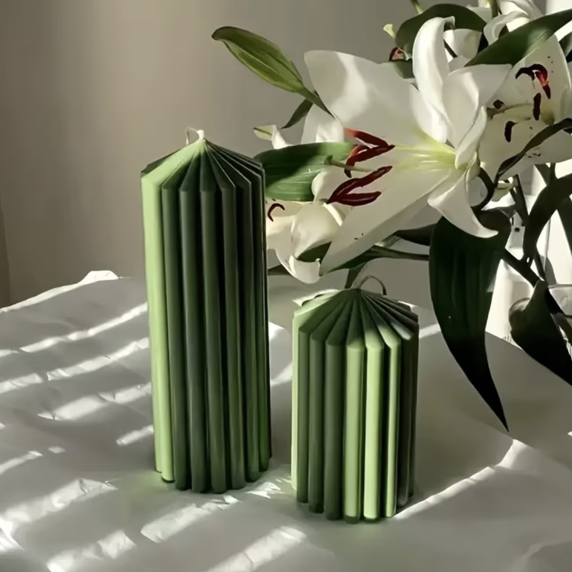 Pleated Column Candle — Architectural pleats in two statement heights.