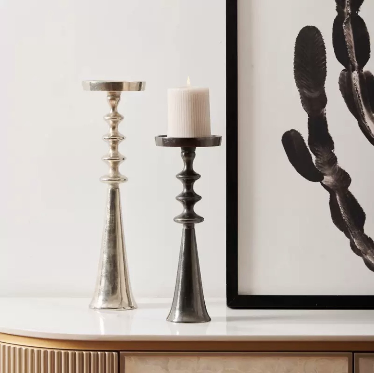 Silver and black stacked pillar candle holders in two heights