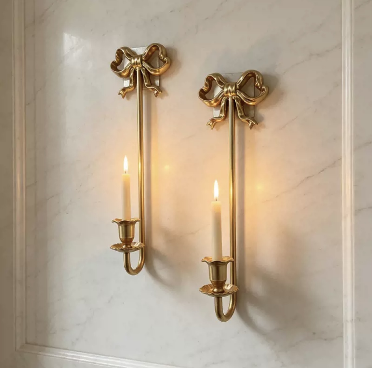 Pair of decorative brass bow wall-mounted taper candle holders