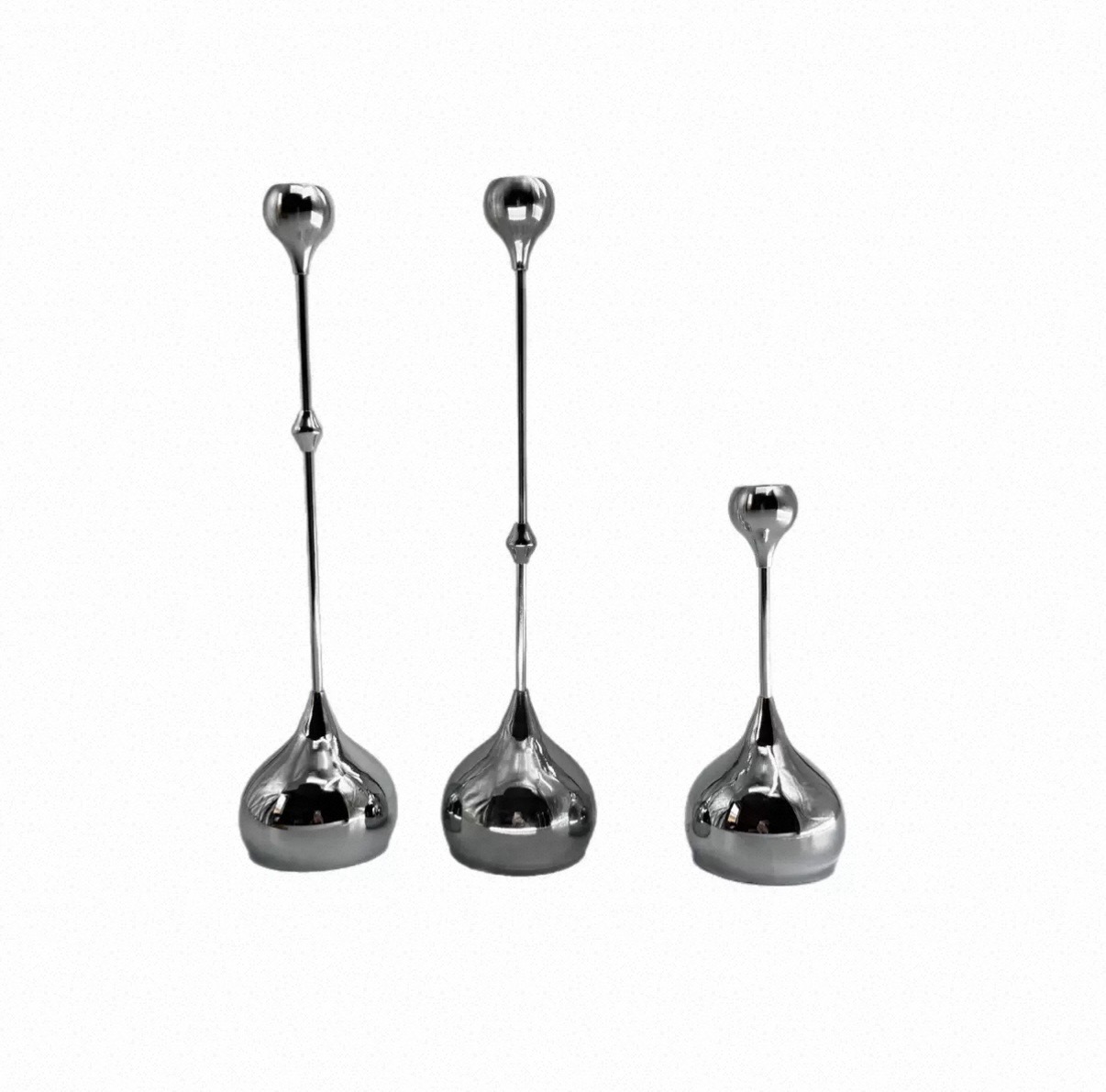 Polished silver tulip-top candlesticks in three heights
