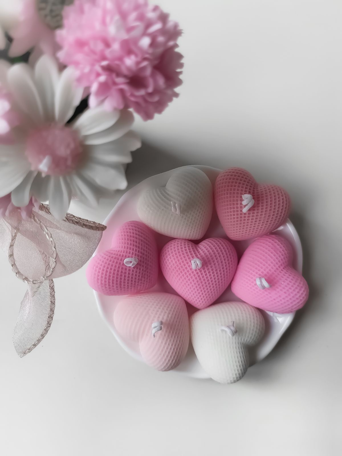 Heart Candle — Textured hearts in soft blush and ivory.