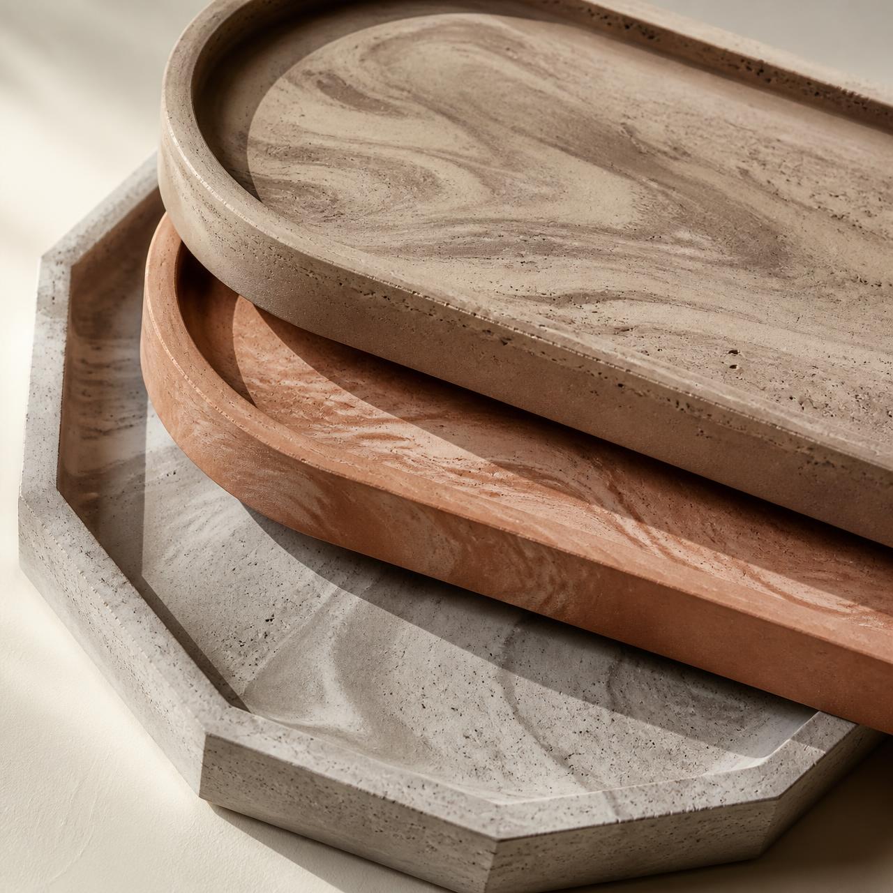 Hand-marbled jesmonite trays in terracotta, taupe and grey